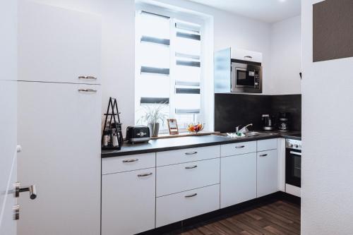 Kuchyň nebo kuchyňský kout v ubytování Ferienwohnung Goitzschezeit