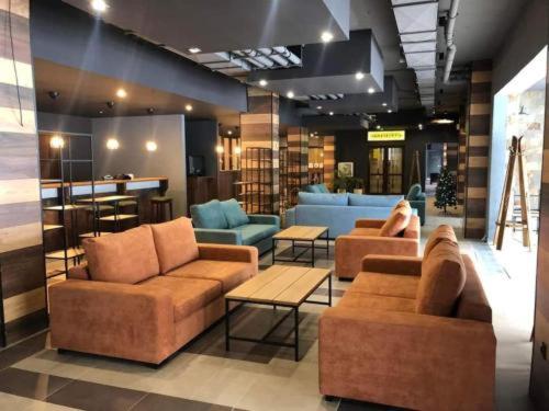 a lobby with two couches and chairs in a store at Lovely Borovets Apartment in Borovets