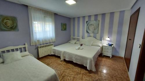 Ένα ή περισσότερα κρεβάτια σε δωμάτιο στο Hospedaje Vistamar