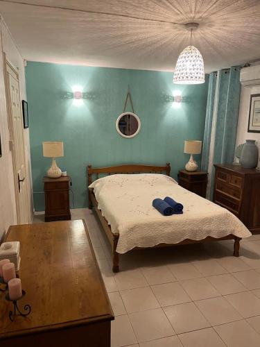 a bedroom with a bed and two tables and two lamps at Villa Tourelle of Paradise with bigPrivate Pool in Rivière Noire