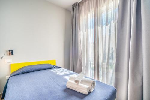 Posteľ alebo postele v izbe v ubytovaní Villa Kòsmos - Piscina e Giardino - Villasimius