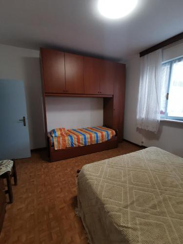 Postel nebo postele na pokoji v ubytování CasAngelica Alloggio indipendente con parcheggio interno