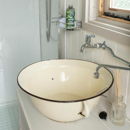 a bathroom with a white sink on a counter at Little Oakhurst in Clitheroe