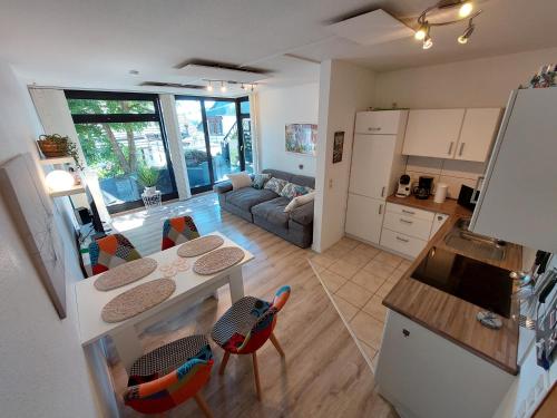 a kitchen and living room with a table and chairs at Mira in Winterberg