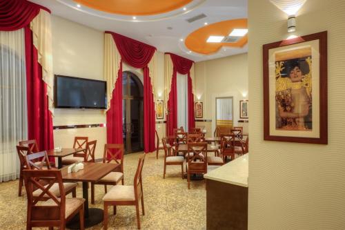 A restaurant or other place to eat at Grand Voyage Hotel