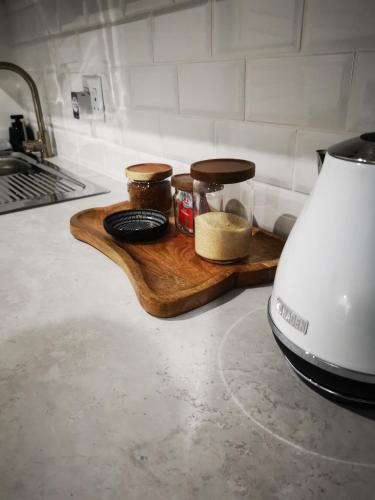 a kitchen counter with a cutting board with food on it at 10 Jock Meiring Guesthouse Unit 3 in Bloemfontein