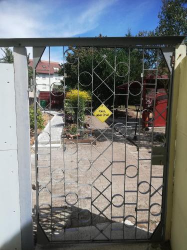 an open gate with a playground behind it at Ochsenhof in Feuchtwangen