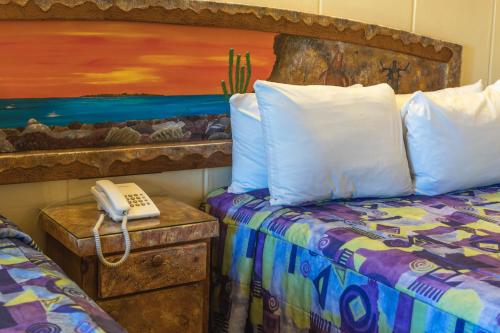 Ein Bett oder Betten in einem Zimmer der Unterkunft Hotel Oasis