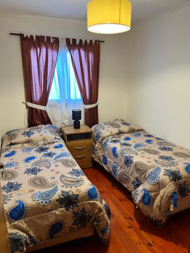 Cama o camas de una habitación en el Departamento equipado en complejo residencial