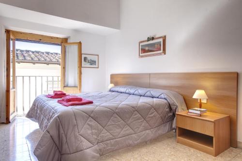 Ліжко або ліжка в номері Appartamento Alfanihouse