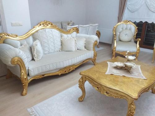a living room with a white couch and a coffee table at Trabzon Luxury Homes in Trabzon