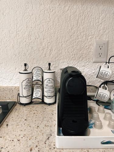 a toaster sitting on top of a counter with at Hermoso Departamento Nuevo a 50 metros de playa!! in Manzanillo