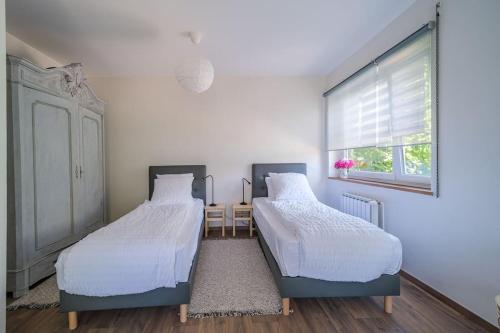 Katil atau katil-katil dalam bilik di Cosy Home in South Alsace for work and leisure