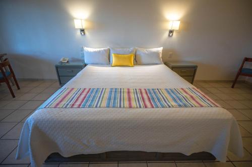 Ein Bett oder Betten in einem Zimmer der Unterkunft Hotel Oasis