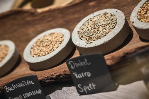 a bunch of different types of grains in bowls at Tenne Lodges in Racines