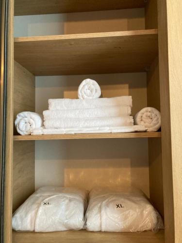 a closet filled with lots of white towels at Lileo in Tsalka