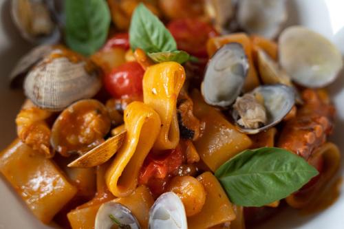 a bowl of food with mushrooms and vegetables at Il Sole in Bergamo