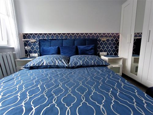 Postel nebo postele na pokoji v ubytování Kryształowy apartament