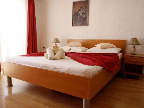 a bedroom with a large bed with white sheets at Apartments with parking space Orebic, Peljesac - 10088 in Orebić