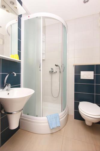 a bathroom with a shower and a sink and a toilet at Apartments with parking space Orebic, Peljesac - 10173 in Orebić