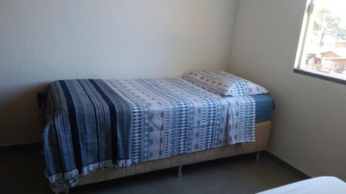 Postel nebo postele na pokoji v ubytování Residencial Marbella