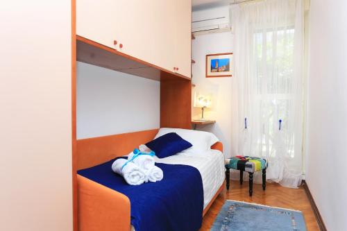 a bedroom with a bunk bed and a mirror at Apartments with WiFi Split - 11783 in Split