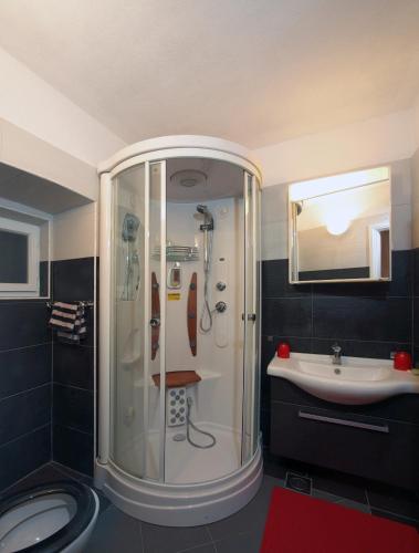 a bathroom with a shower and a sink at Seaside holiday house Orebic, Peljesac - 11853 in Orebić