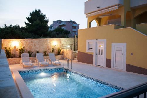 Seaside apartments with a swimming pool Zecevo Rtic, Rogoznica - 11869