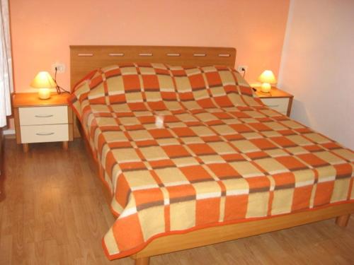 a large bed in a room with two night stands at Apartments with a parking space Kosi, Labin - 11891 in Labin