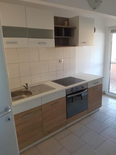 a kitchen with a sink and a counter top at Apartments and rooms by the sea Nevidjane, Pasman - 11902 in Neviđane