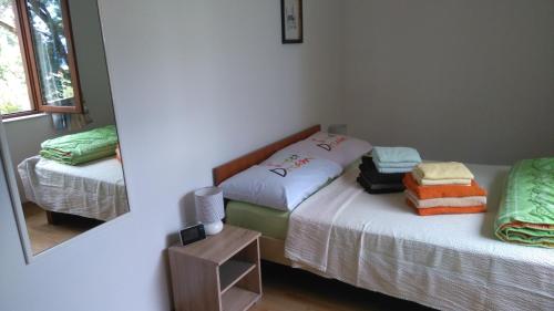 a bedroom with two beds and a mirror at Seaside holiday house Mokalo, Peljesac - 12137 in Orebić