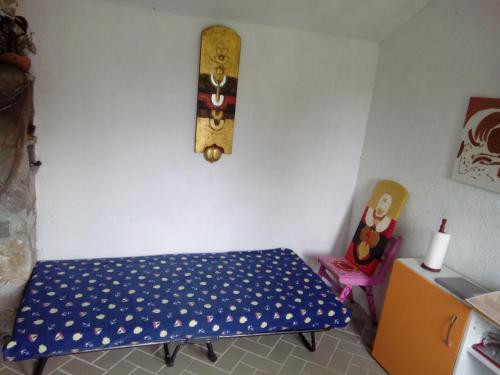 a room with a table and a skateboard on the wall at Secluded fisherman's cottage Radelj, Murter - 12155 in Murter