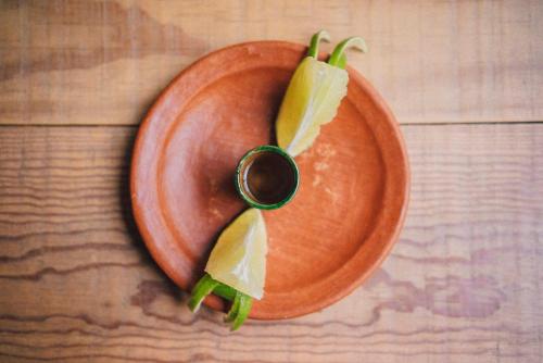 a plate with a ring on it with leaves on it at Casa Carmen Reforma in Oaxaca City