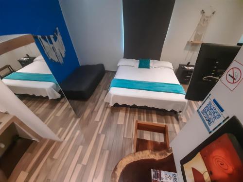 Ένα ή περισσότερα κρεβάτια σε δωμάτιο στο Hotel Boutique Casa Mariano