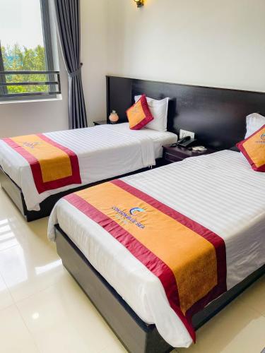 Katil atau katil-katil dalam bilik di Con Son Blue Sea Hotel