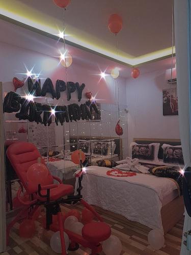 a bedroom with a happy birthday sign and a bed at Tina 2 Hotel in Cái Răng