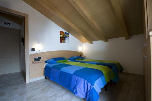 Ein Bett oder Betten in einem Zimmer der Unterkunft Casa Fiorella