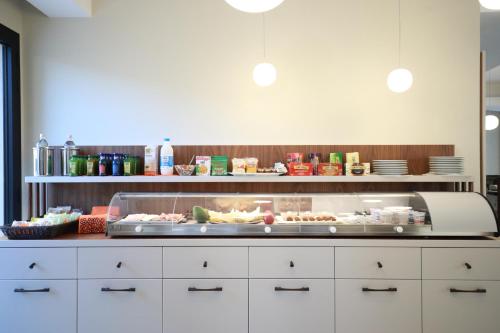 a kitchen with a buffet of food on a counter at Solmaris Tropea Rooms & Suites in Tropea
