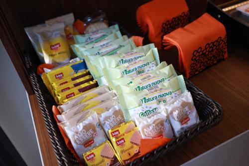 a basket filled with different types of cheese at Solmaris Tropea Rooms & Suites in Tropea