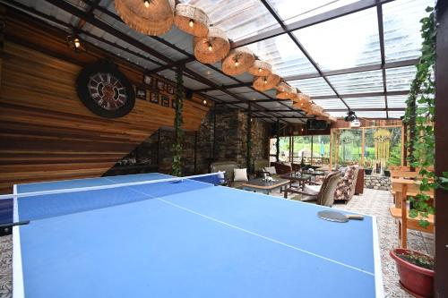 a ping pong table in an outdoor patio at The Hillside in Kasol