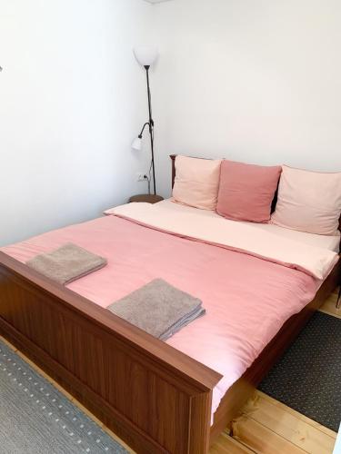Ein Bett oder Betten in einem Zimmer der Unterkunft Apartamentai Biržuose, Kęstučio gatvė