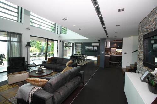 a living room with a couch and a fireplace at Villa Hanan Sarajevo in Sarajevo