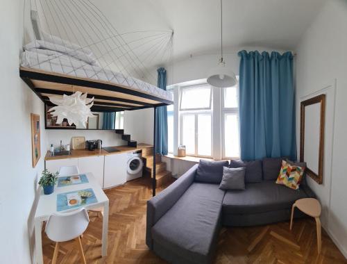 a living room with a couch and a table at Planet Hostel in Warsaw