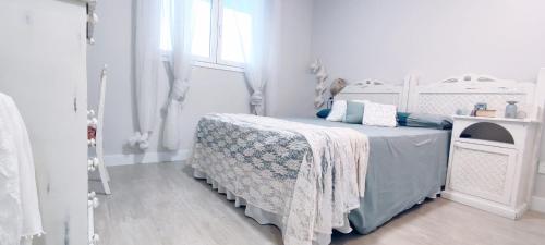 Ένα ή περισσότερα κρεβάτια σε δωμάτιο στο Dunas Beach Apartment