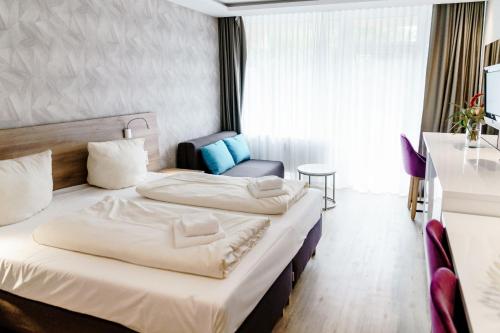Postel nebo postele na pokoji v ubytování Haus am See Luxury HS 225 B