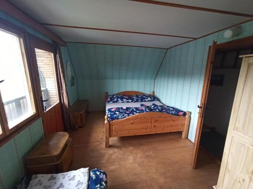 En eller flere senge i et værelse på Chata KOZLOV