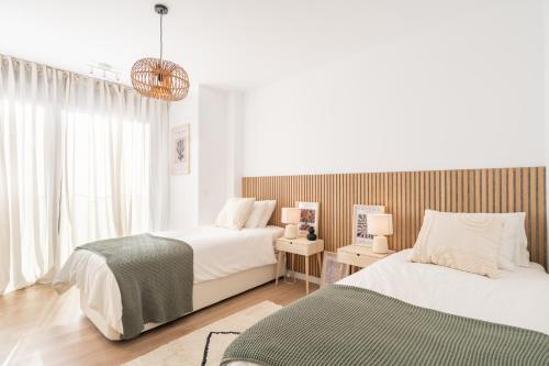 Posteľ alebo postele v izbe v ubytovaní Malasaña 13, Nuevo apartamento 2 dormitorios, centro histórico, todos servicios, barrio tranquilo, MS