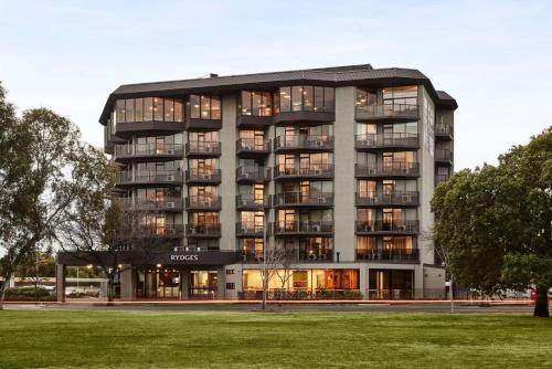 a large apartment building with a lot of windows at Rydges South Park Adelaide in Adelaide