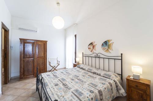 Posteľ alebo postele v izbe v ubytovaní Stintino sea front apartments B