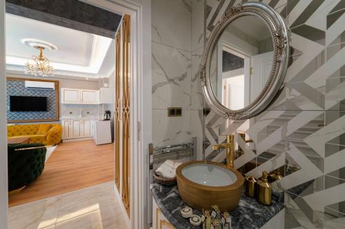 a bathroom with a sink and a mirror at Pearl of Cappadocia in Avanos